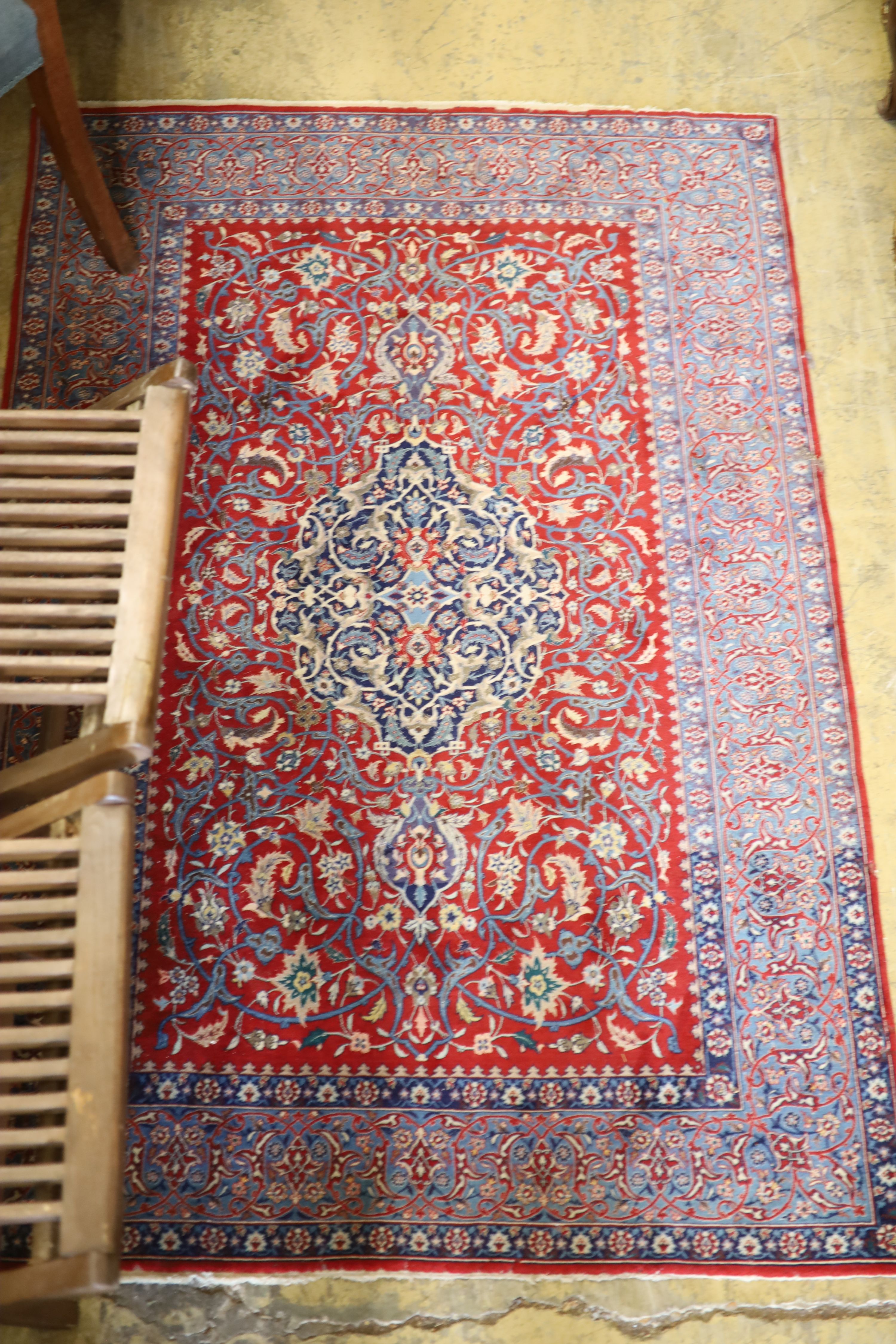 An Isfahan red ground rug, 169 x 110cm